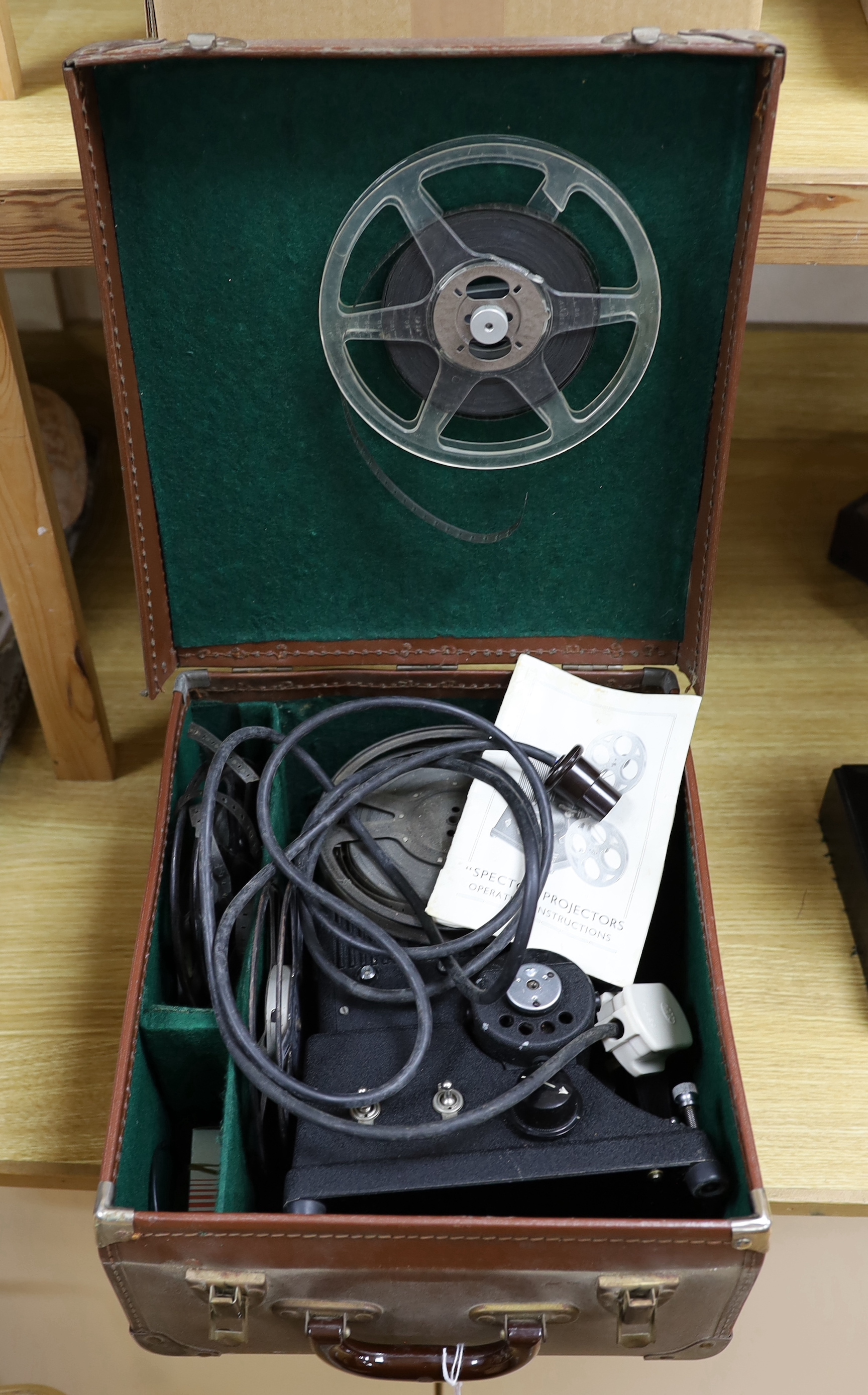 A Specto 9.5mm cine film projector in a leather case, case 32cm x 38cm x 18cm